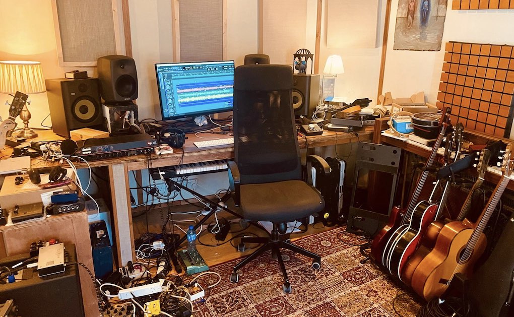 An empty chair beside the equipment in the studio