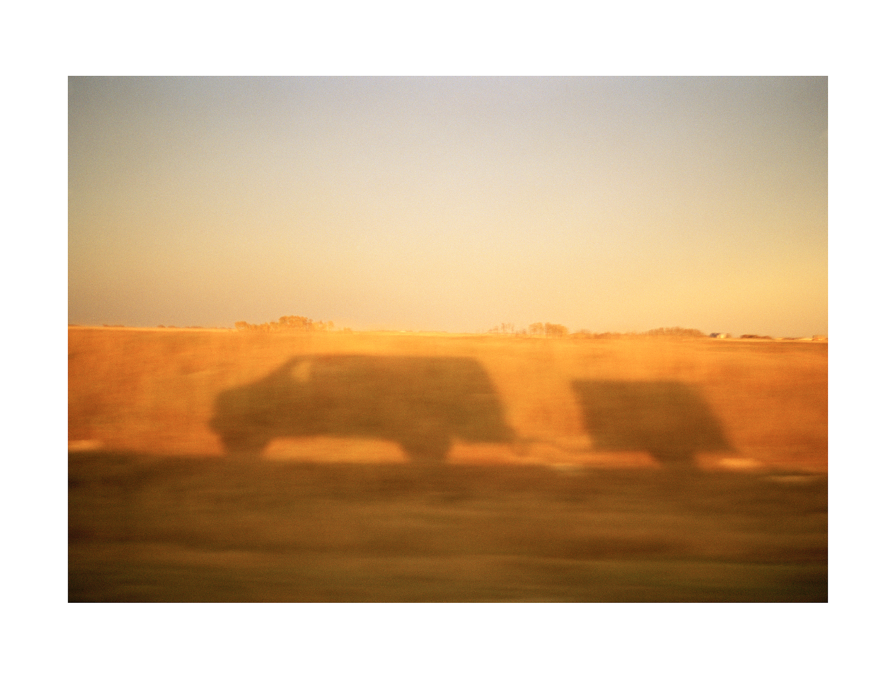 Cornfield Reflection, Saskachewan, Canada, 2004 . On the way to the accident that day. I’m proud of this as I took it from inside the van. Analogue film camera.