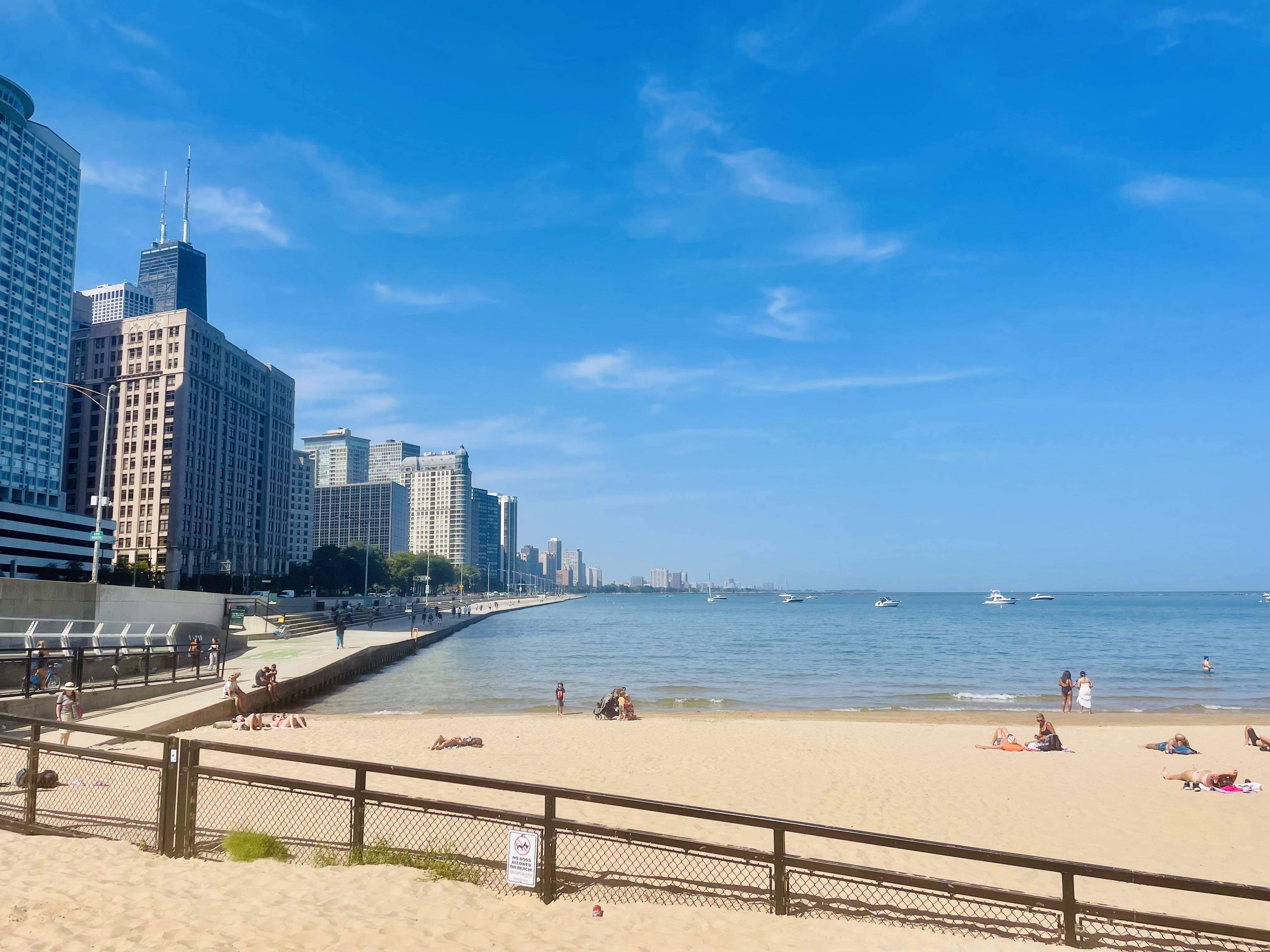 How a postage stamp of a beach in the Chicago can only have a few dozen people on it, while metres away, the thronging throbbing , hustling bustling population of 2.75 million people does its thing? Americans are hard workers.